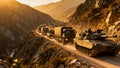 Military Convoy Vehicles Moving Through Mountain Pass Deployment Royalty Free Stock Photo