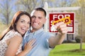 Military Couple In Front of Home, House Keys and Sign Royalty Free Stock Photo