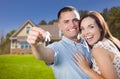 Military Couple with House Keys In Front of New Home Royalty Free Stock Photo