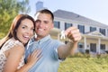 Military Couple with House Keys In Front of New Home Royalty Free Stock Photo