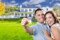 Military Couple with House Keys In Front of New Home Royalty Free Stock Photo