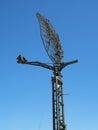 Military directional antenna on a blue sky. Royalty Free Stock Photo