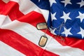 military dog tags on American flag with embroidered stars Royalty Free Stock Photo