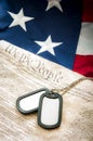 Military dog tags, US constitution and American flag Royalty Free Stock Photo