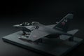 Miniature of military fighter without pilot cabin on a black background with place for text Royalty Free Stock Photo