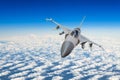 Military fighter jet above the clouds.