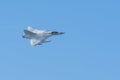Military fighter jet flying fast through the air in coordination with team. War, combat, teamwork, precision concepts. UAQ Union Royalty Free Stock Photo