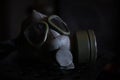 Military Gas Mask in dark ambient. Coronavirus, Covid19 pandemic prevention. Toxic, biohazard and infection danger