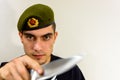 Military green beret with a knife Royalty Free Stock Photo
