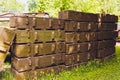 Military green boxes with dangerous explosives, guns and military weaponry, ready for shipping, in a munition producing