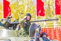 Military greeting by the commander of the crew of armored vehicles at a parade rehearsal on a city street