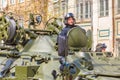 Military greeting by the commander of the crew of armored vehicles at a parade rehearsal on a city street