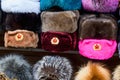 Military hats ushanka of different colors with the USSR coat of arms and red stars as Souvenirs from Moscow