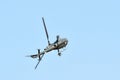 Military helicopter flying on side