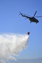 Military helicopter extinguish fire with water