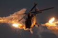 Military helicopter firing flares