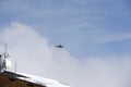 Military helicopter. Italian military helicopter in the sky. Military helicopter against the background of a blue sky.