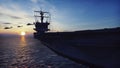 Military helicopters Blackhawk take off from an aircraft carrier at sunrise in the endless sea. 3D Rendering