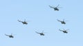 Military helicopters maneuvers in the blue sky Royalty Free Stock Photo