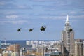 Military helicopters in the sky. Moscow city panorama