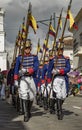 Military honor guard in historic uniforms march in parade