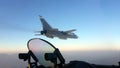 Military jet bomber Su-24 Fencer flying above the clouds