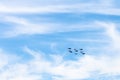 Military low-flying aircrafts in white clouds Royalty Free Stock Photo