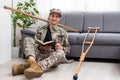 military man with crutches, disability