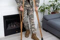 military man with crutches, disability
