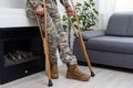 military man with crutches, disability