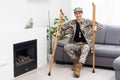 military man with crutches, disability