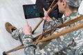 military man on crutches with tablet doctor