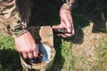 A military man equips an automatic horn with cartridges Royalty Free Stock Photo