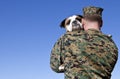 Military Man Hugs Dog Royalty Free Stock Photo