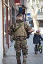 military man patroling in the street whit shotguns