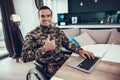 Military Man in Wheelchair Uses Laptop Thumbs Up Royalty Free Stock Photo
