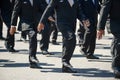 Military marching in a street. Legs and shoes in line