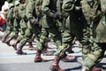 Military marching in a street. Legs and shoes in line