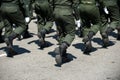 Military marching in a street. Legs and shoes in line