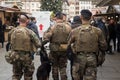 Military mens patroling in the street whit shotgun