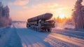 Military missile carrier truck on snowy road at sunset in winter landscape