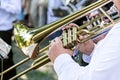 Military musician blowing his gold trombone Royalty Free Stock Photo