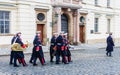 Military musicians soldiers marching to the entrance of the Pra