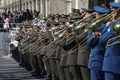 Military musicians in uniform standing in a line and playing trumpets. Military parade