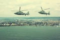 Military navy helicopter flying over coastline Royalty Free Stock Photo