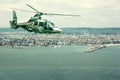 Military navy helicopter flying over coastline Royalty Free Stock Photo