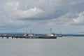 Military Navy Patrol Boat is mooring at Marine Dock. Royalty Free Stock Photo