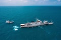 Military navy ships in a sea bay with fishing boat Royalty Free Stock Photo