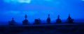 Military navy ships in a sea bay at sunset time. Selective focus Royalty Free Stock Photo