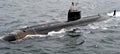 Military nuclear submarine launching torpedo missile in expansive oceanic waters